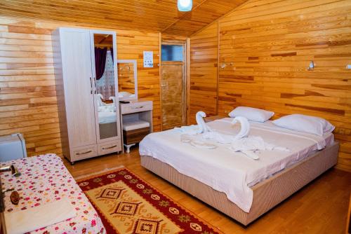 Кровать или кровати в номере Ikiz Pension Bungalow