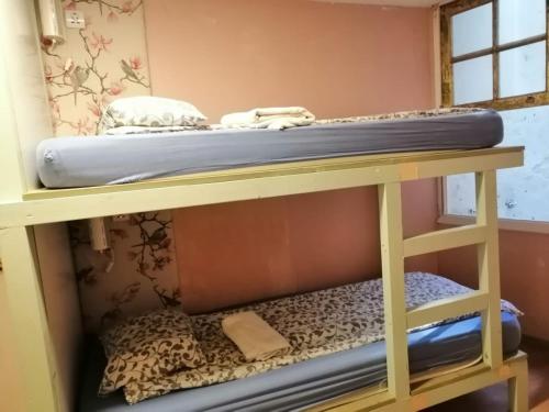 a bunk bed in a room with a mattress at International Hostel Lapplandia B&B. in Vigo