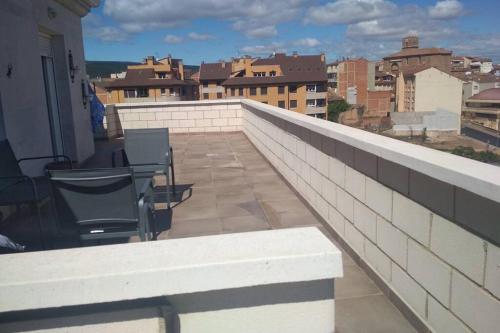 a balcony with chairs and a view of a city at Atico con vistas únicas. VT-LR-1352 in Entrena
