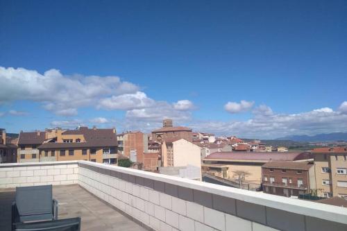 a chair sitting on the ledge of a roof at Atico con vistas únicas. VT-LR-1352 in Entrena