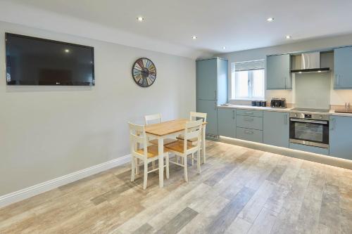 a kitchen with a table and chairs in a room at Host & Stay - Sunny Dale Cottage in Thornton Dale