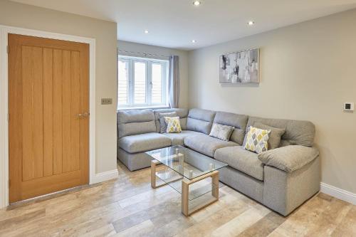 a living room with a couch and a table at Host & Stay - Sunny Dale Cottage in Thornton Dale