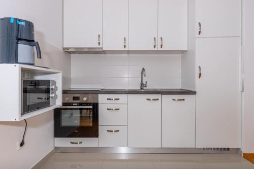 Kuchyň nebo kuchyňský kout v ubytování Apartmani Relax