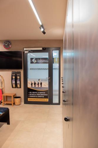 a lobby with a movie poster on the wall at Hotel Olympia in Obergurgl