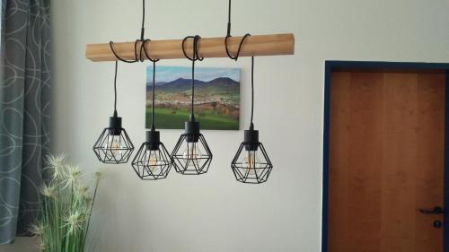 a group of lights hanging from a chandelier at Apartment Auszeit in Kirchberg an der Pielach