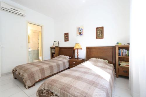 Postel nebo postele na pokoji v ubytování Victor Apartment