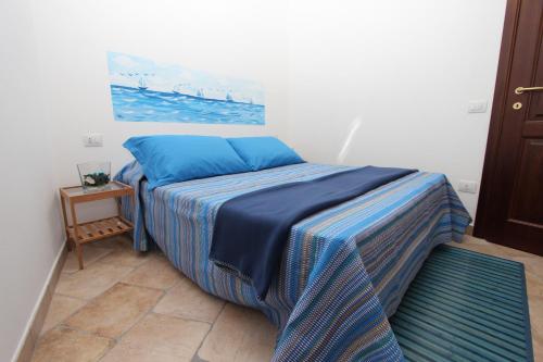 Postel nebo postele na pokoji v ubytování B&B Acquamarina Villasimius