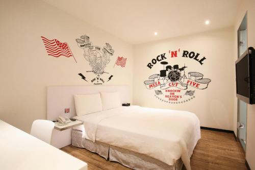 Ein Bett oder Betten in einem Zimmer der Unterkunft CityInn Hotel Plus - Ximending Branch