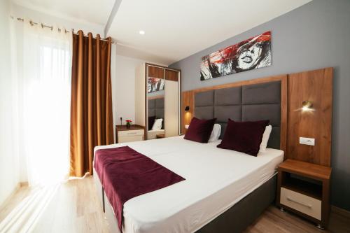 Postel nebo postele na pokoji v ubytování Apartments Fati