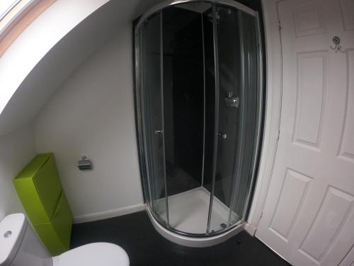 a bathroom with a glass shower and a toilet at Bed-and-Bread in Blairgowrie
