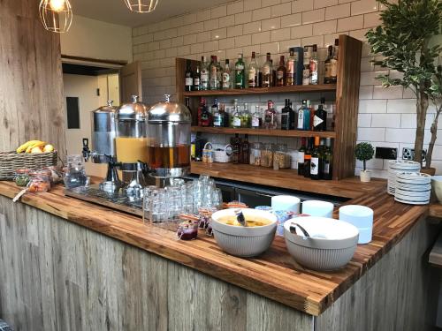 a counter with bowls of food on top of it at The Sunningdale in Bamburgh