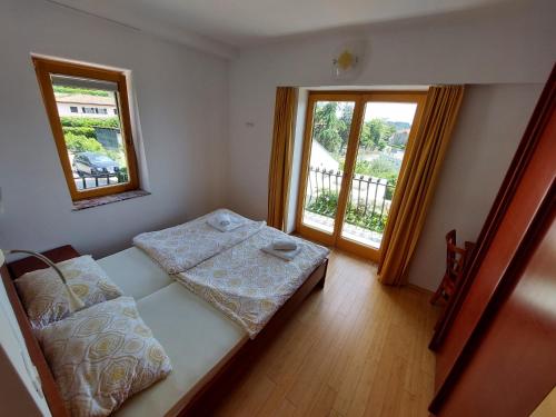Postel nebo postele na pokoji v ubytování Apartmaji Fizine