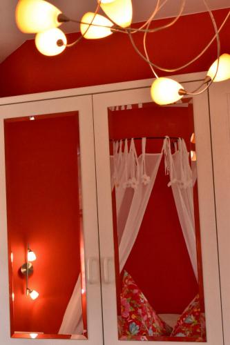 a bathroom with a mirror and a ceiling at Gastinger Hotel-Restaurant in Schmiedefeld am Rennsteig