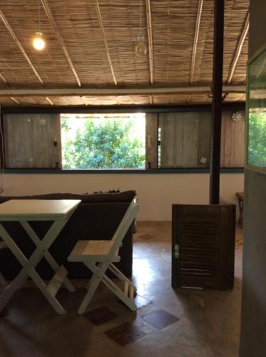 a room with a ping pong table in the middle at Casa Grande Flats in Abraão