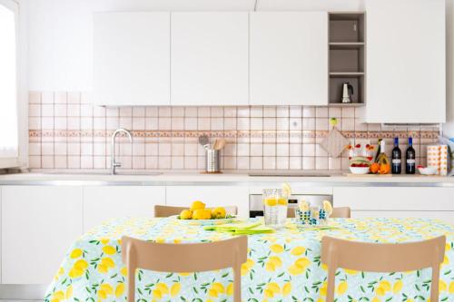 a kitchen with a table with fruit on it at Fruttadamare in Porto Recanati
