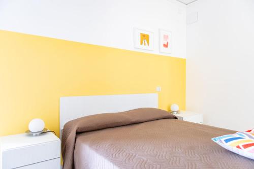 a bedroom with a bed and two night stands at Fruttadamare in Porto Recanati