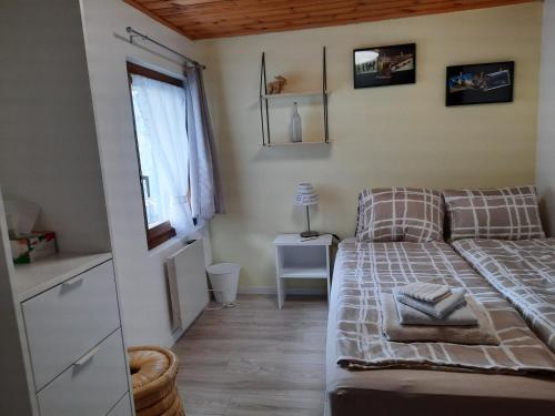 a small room with a bed and a couch at Chalet Clair de Lune bei Grächen VS in Gasenried