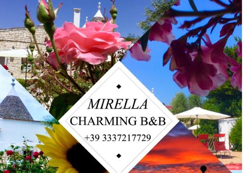 un cartello davanti a un mazzo di fiori di B&B Mirella ad Alberobello