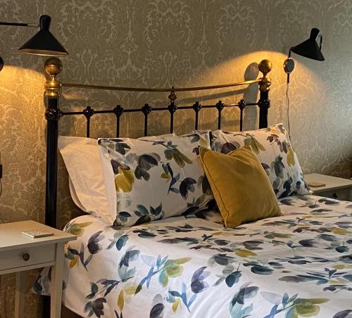 A bed or beds in a room at Treveighan Farmhouse