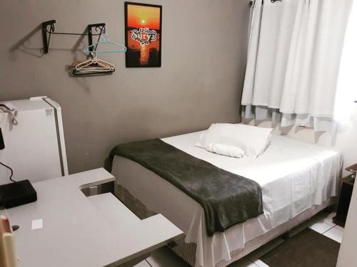 Кровать или кровати в номере Pousada Surya