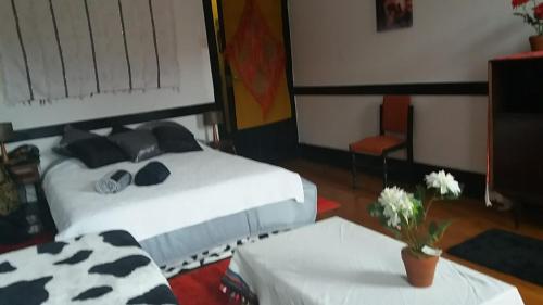 a bedroom with a bed with black and white pillows at AL- Almada 4 in Porto