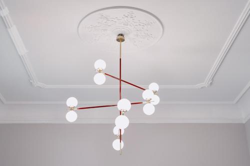 a chandelier hanging from a ceiling in a room at MiraMe Athens Boutique Hotel in Athens