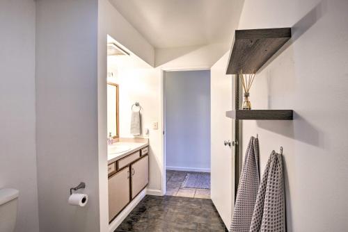 a bathroom with a sink and a toilet at Big Island Condo with Pool Access 1 Mi to Beach! in Kailua-Kona