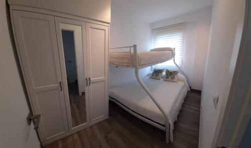 A bed or beds in a room at Apartamento Calpe - La Fossa - Peñon Ifach