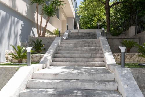 a set of concrete stairs in front of a building at Bošket Luxury Rooms in Split