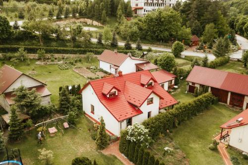an aerial view of a house with red roofs at DOMEK NA ZARZECZU in Bałtów