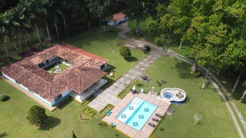 an aerial view of a house with a swimming pool at Hotel Campestre Pueblo Bello in Armenia
