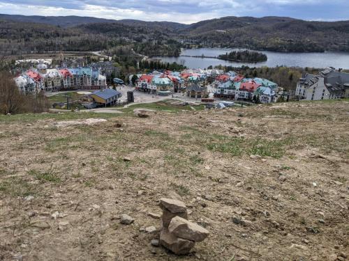 a pile of rocks sitting on top of a hill at Escapade Bonheur in Lac-Superieur