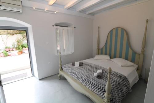 Кровать или кровати в номере Serenity Residence