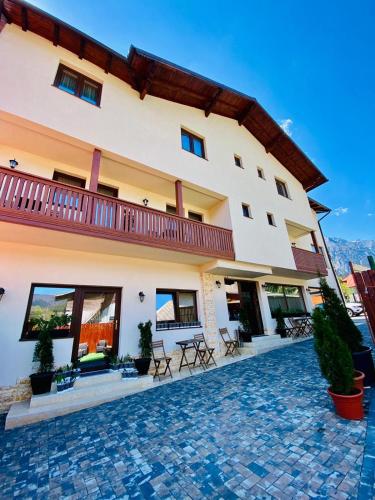 a villa with a view of the building at CASA ANKELI in Buşteni