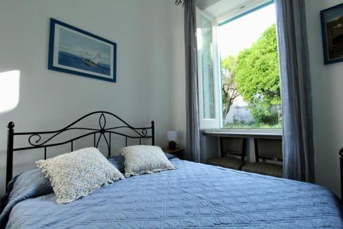 Ένα ή περισσότερα κρεβάτια σε δωμάτιο στο La Casa Bianca