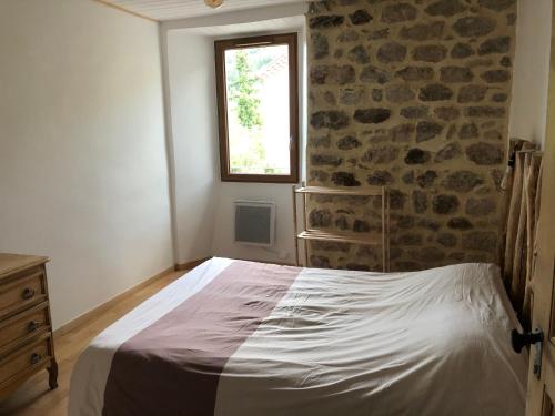 A bed or beds in a room at Appartement 6 personnes valgorge