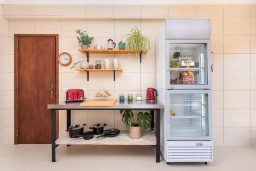 a refrigerator with its door open in a room at Villa Boho in Lagos