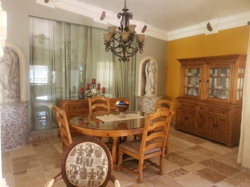 a dining room with a table and chairs at Maria's Place, Puerto Peñasco, Oriente in Puerto Peñasco
