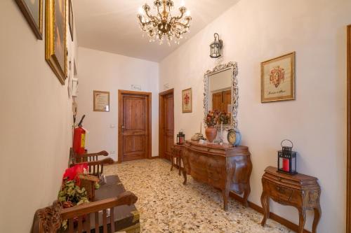 a room with a mirror and a wooden dresser at Dimora Del Magnifico in Florence