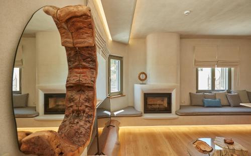 a room with a living room with a fireplace at Sunrise Garden Hills in Makrirrákhi