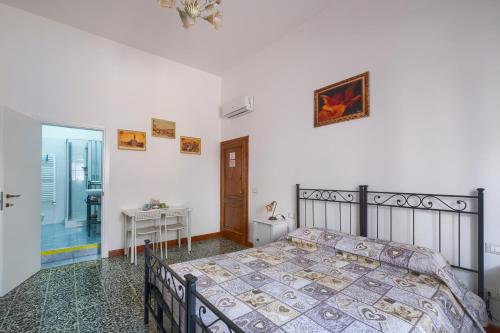 a bedroom with a bed and a desk and a window at Dimora Del Magnifico in Florence
