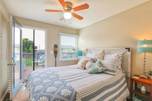 a bedroom with a bed with a ceiling fan at 432 Saratoga in Grover Beach