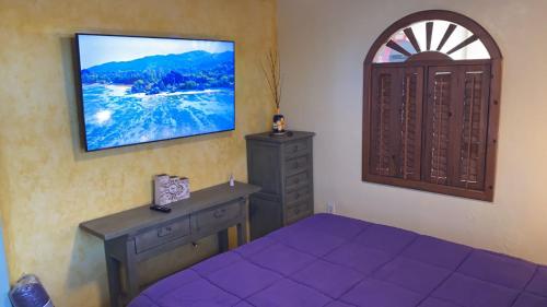 Ένα ή περισσότερα κρεβάτια σε δωμάτιο στο Loft with rooftop deck in the Malecon - Unit #206