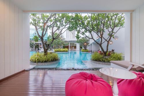 a view of a swimming pool from a hotel lobby at The Sea Cret Hua Hin in Hua Hin