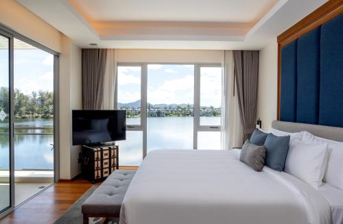 Ένα ή περισσότερα κρεβάτια σε δωμάτιο στο Angsana Laguna Phuket