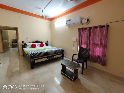 מיטה או מיטות בחדר ב-Vizag homestay guest house