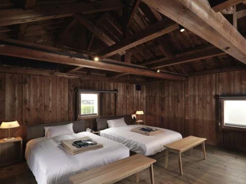 Кровать или кровати в номере HOTEL CULTIA DAZAIFU