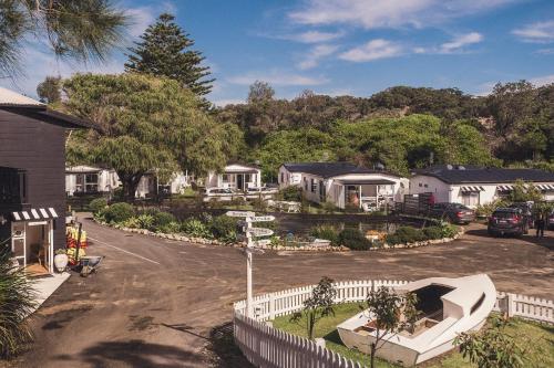 an aerial view of a house with a white fence at The Cove Jervis Bay in Jervis Bay Village