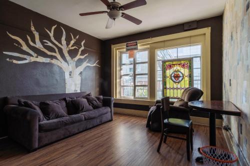 a living room with a couch and a table at Lucky D's Youth and Traveler's Hostel in San Diego