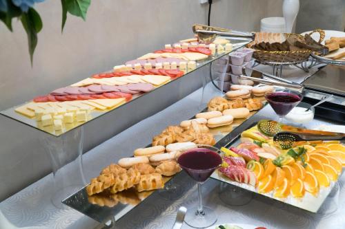 a buffet filled with lots of different types of food at East Palace Hotel in Almaty
